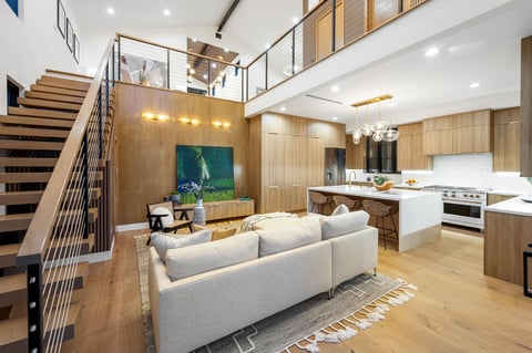 The interior design of a modern living room with a staircase